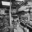 Interior of former smithy with forge in corner