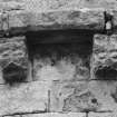 Detail of two corbels on apse