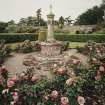 Walled garden, rose garden, sundial capped by small figure, view from SE