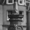 Walled garden, rose garden, sundial capped by small figure, detail