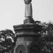 Walled garden, rose garden, sundial capped by small figure, detail