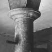 Interior view of stables, east pavilion, detail of capital of arcaded stalls