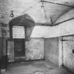 Interior - basement, east apartment of barrel-vaulted range from north
