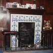 Interior. Detail of fireplace in entrance hallInterior. Detail of fireplace in entrance hall with blue and white figurative tiles