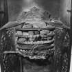 Interior. Detail of fireplace in entrance hall showing register grate with toasting armature