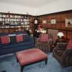 Interior. View of ground floor TV room original dining room from NE showing bookcases