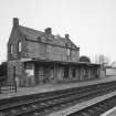 View from N of station offices and house, situated on the S-bound platform on the SE side of the station