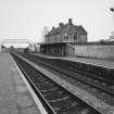 General view from W, showing both platforms, the footbridge, and the station house and offices