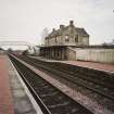 General view from W, showing both platforms, the footbridge, and the station house and offices