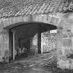 Stables, archway with drinking trough