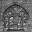 All Saints Episcopal Church, interior.  North side chapel, detail of stained glass window at West end.
