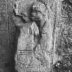 Carved effigy built into west wall at rear