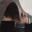 Detailed view from SSE of the curved brick viaduct forming the south end of the bridge.
