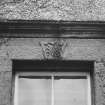 Detail of carved lintel and cornice above first floor window from South.