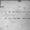 Interior.
Detail of brick wall with painted headings to record sortie details.