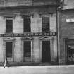 General view of Low Street, Banff, showing front of Clydesdale & North of Scotland Bank Limited and part of Rose's Temperance Hotel above Chas. C. Walker, Grocers.