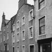 General view from S-E of 9 Boyndie Street and adjacent buildings.