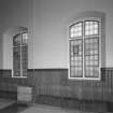 N wall, windows with geometric patterned glazing, detail