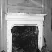 Detail of fireplace in N-E room on ground floor.