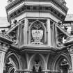 Detail of heraldic panel and decorative stonework.