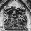 View of South armorial panel on mausoleum wall.