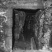 Interior, basement.
View of doorway and site of straight flight of stairs to first floor.