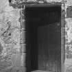 Detail of central doorway in South wall of re-entrant angle.