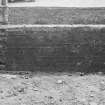 Detail of the remains of gatepiers of former forecourt in re-entrant angle.