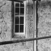 Fyvie Castle.
Detail of Seton Tower entrance bay showing partly blocked window in West re-entrant during restoration.