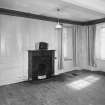 Interior.View of ground floor South room/ parlour from North showing the fireplace and panelling