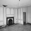 Interior.View of ground floor North room dining room from South showing sideboard recess, fireplace and panelling