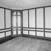 Interior. View of first floor South room/ drawing room from West showing closed china closet and panelling