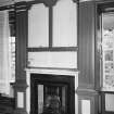 Interior. View of first floor South room/ drawing room from North showing fireplace flanked by giant fluted pilastersand Nineteenth Century grate