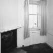 Interior. View of first floor North East room/ dressing room from West showing fireplace