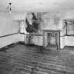 Interior. View of second floor South room from North showing coombed ceiling and fireplace