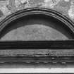 Detail of semicircular pediment above entrance