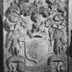 Detail of armorial panel, with sheild held by two angels, one side bearing the arms of Fraser of Philorth, the other blank.