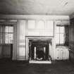 Interior.
General view of the panelling and fireplace on the North wall of the first floor apartment.