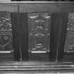 Pews, carved panels, detail