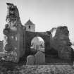 Remains of church with tower behind, view from east