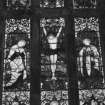 Interior. Detail of E stained glass window medieval tracery with stained glass by C E Kempe