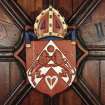Aberdeen, Chanonry, St Machar's Cathedral, Heraldic Ceiling.
Detail of the Heraldic Shield of the arms of the Bishop of Moray: James Hepburn. 
Shield: Gules, on a chevron argent a rose between two lions combatant of the field, in base a heart-shaped buckle of the second.