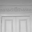 Ground floor, sitting room, pediment above door, decorative plasterwork, detail