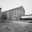 Aberdeen, Grandholm Works.
General view from North-West of old mill and stair tower, sluicegates and fuel oil tank.