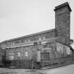 Aberdeen, Grandholm Works.
General view from South-East of the water turbine houses and tail race with the old mill and its stair tower behind.