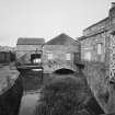 Aberdeen, Grandholm Works.
General view from E-N-E of scouring house, fibre store, sluice gates, water turbine house with arched tail race and water turbine house.