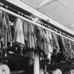 Aberdeen, Grandholm Works, interior.
Detail of cloth samples hanging in warehouse.