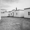 Aberdeen, Greyhope Road, Girdleness Lighthouse.
View from North-East of courtyard (with granite setts) and keepers' houses, dated 6 May 1992.