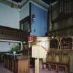 Interior. View of platform from N showing communion table and pulpit