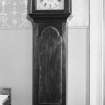 Interior. View of grandfather clock.